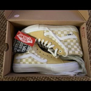 Vans new with tags. “Banana/marshmallow” checkerboard high tops. Men’s size 8